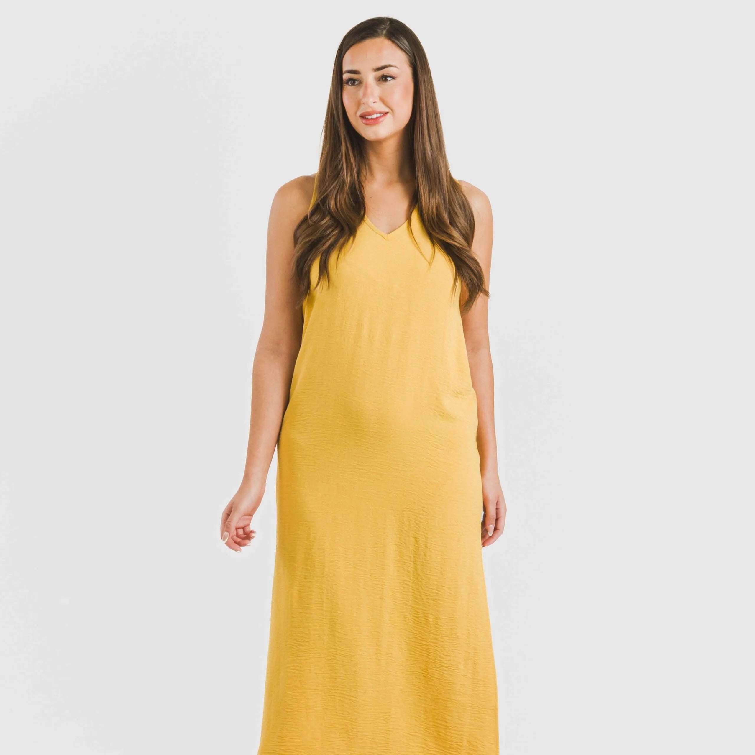 Vestido longo de alças finas em musselina de algodão lisa.