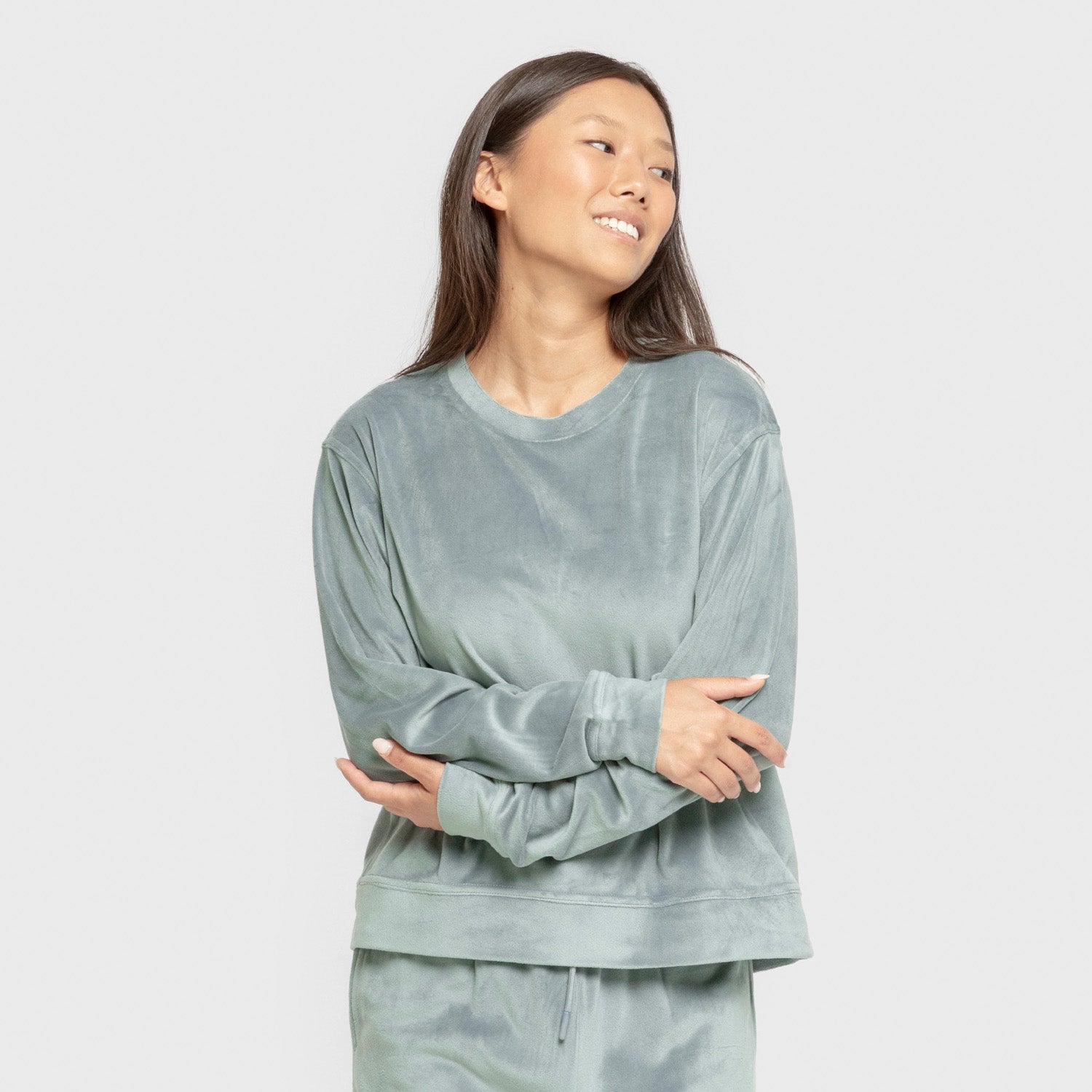 Pijama de veludo liso super macio na cor azul-turquesa.