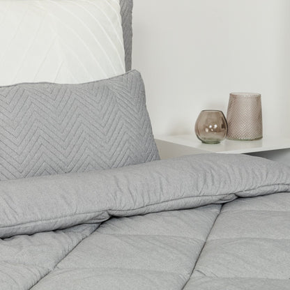 Edredom liso com efeito desgastado