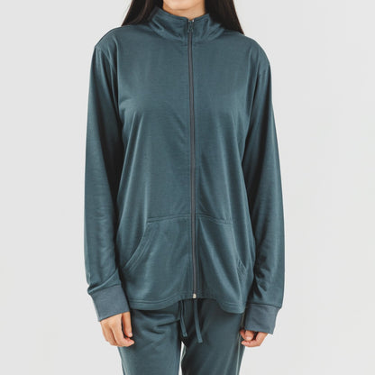 Conjunto de moletom feminino azul-petróleo com zíper e jaqueta.