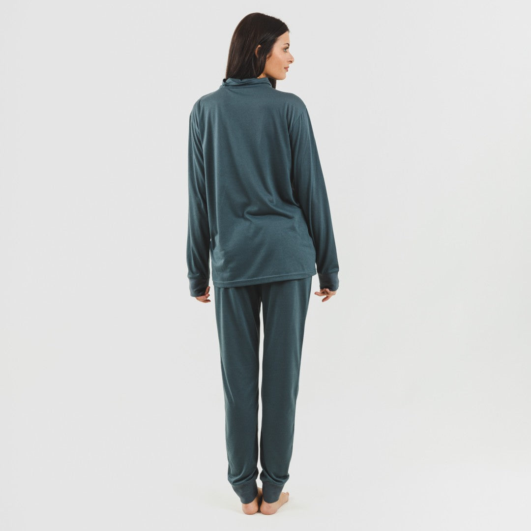 Conjunto de moletom feminino azul-petróleo com zíper e jaqueta.